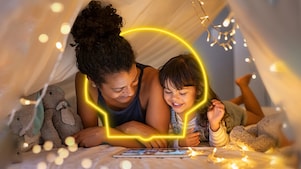 Women and girl playing on Ipad